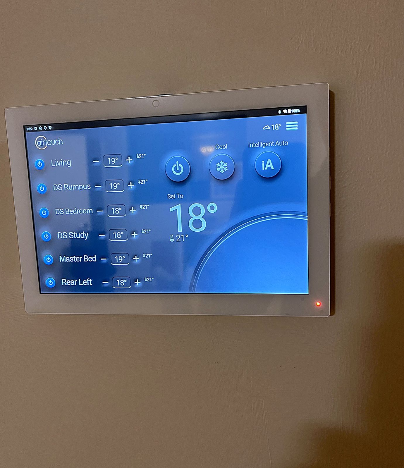 AirTouch smart controller wall console showing per-zone temperature control, installed by A-Temp