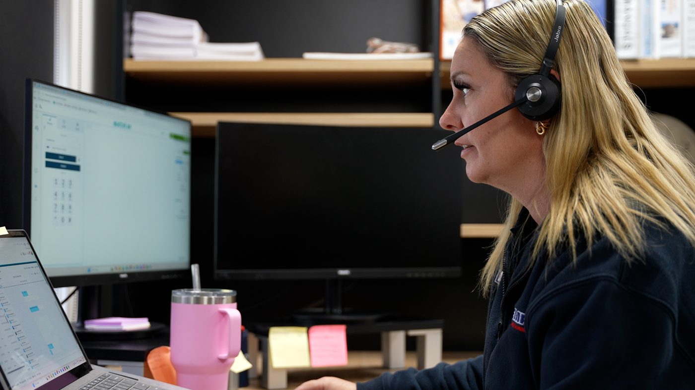 A-Temp customer support team member taking a call